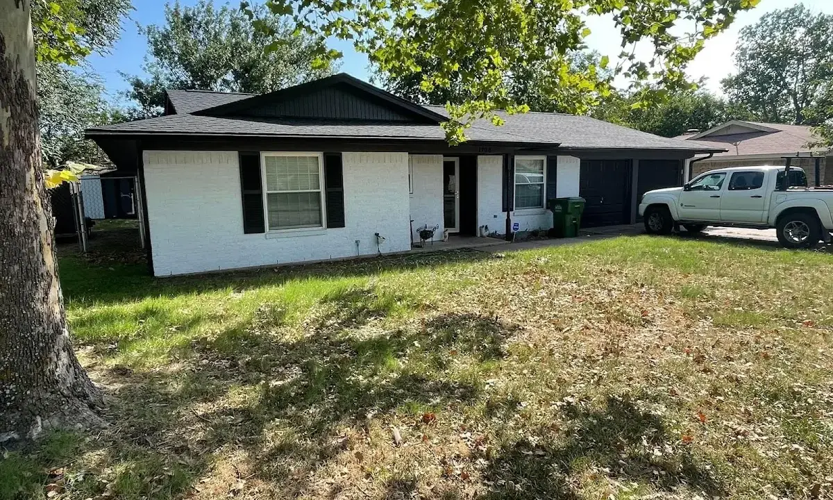 Professional roofing crew working on a residential roof in Cave Creek